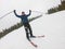 A young man in sports glasses and skiing in the mountains