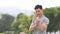 Young man in sportswear checking result jogging on his smart watch during morning workout in the park