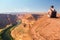 Young man standing at the edge of the Horse Shoe Bend cliff