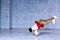 Young man standing on hands in dance.