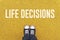 Young man standing at Life Decisions sign