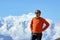 A young man stands smiling against the backdrop of the Annapurna massif. Nepal.