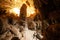 A young man stunning the large cave complex in Koh Wua Ta Lap in Gulf of Thailand