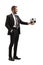 Young man in a suit giving a soccer ball