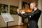 Young man in suit play violin