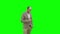 Young man in suit walking and sending text message on mobile phone on a Green Screen, Chroma Key.