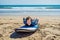 Young man surfer training before go to lineup on a sand beach. L