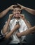 A young man surrounded by hands like his own thoughts