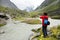 Young man taking photos in Akkem Valley