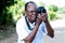 Young man taking pictures with a digital camera in campaign