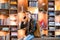 Young man taking by smartphone in bookstore