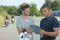 Young man talking to instructor motorcycle training course