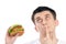 Young man with tasty fast food unhealthy burger