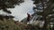 A young man teeters on a slackline in the mountains of the north Caucasus. Slackline en background of the mountains