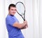 Young man with tennis racket