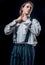 Young man tense face. Young serious man in shirt. Isolated on black studio background. Handsome strong sporty perfect