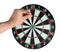 Young man throwing dart at board on white background