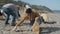 Young man with thumb cleaning the beach