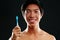 Young man with toothbrush