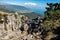 A young man is at the top of Mount Ai-Petri on a sunny summer day. The concept of tourism, extreme