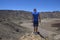 Young man on top of a mountain with amazing panoramic view. Success. Male hiker enjoying the beautiful view from the top.  The