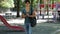 Young man tossing junk in garbage bin