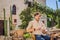 Young man tourist drinks cofee in the old town of Budva. Travel to Montenegro concept