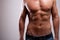 Young man trained topless with abs