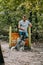 young man training with obedient husky dog on jumping