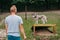 young man training with siberian husky on dog walk