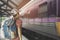 Young man traveler with backpack in the railway, Travel concept