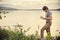 Young Man Traveler with backpack reading book