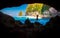 Young Man Traveler enjoy amazing morning view of steep cliff and ocean at tropical beach