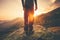 Young Man Traveler feet standing alone with sunset mountains on background