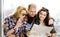 Young man and two women looking at a map. Europeans. Americans. Gathered in a guided tour. Close-up