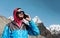 Young Man using Cell Phone in remote high Altitude Mountains