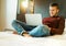 Young man using laptop computer for working at home - Handsome cheerful student relaxing on bed with notebook - Online connected,