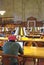 Young man using laptop in library