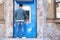 Young man using modern cash machine