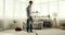 Young Man Using Vacuum Cleaner for Cleaning in the Living Room