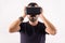 Young man using VR glasses headset holding with hands, portrait. Virtual reality, future technology, education video