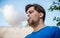 Young man vaping outdoors closeup