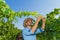 Young man, vine grower, in the vineyard.