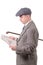 young man in vintage clothes with hat, reading a newspaper, 1940 style