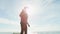 Young man with virtual reality glasses on a beach