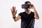 Young man in VR glasses headset gesturing portrait. Virtual reality, future technology, education video gaming