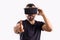 Young man in VR glasses headset gesturing portrait. Virtual reality, future technology, education video gaming