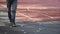 A young man walking away from the playground. Autumn time