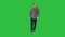 Young man walking looking up fascinated on a Green Screen, Chroma Key.