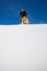 Young man walking with snowshoes/touring skis in high mountains